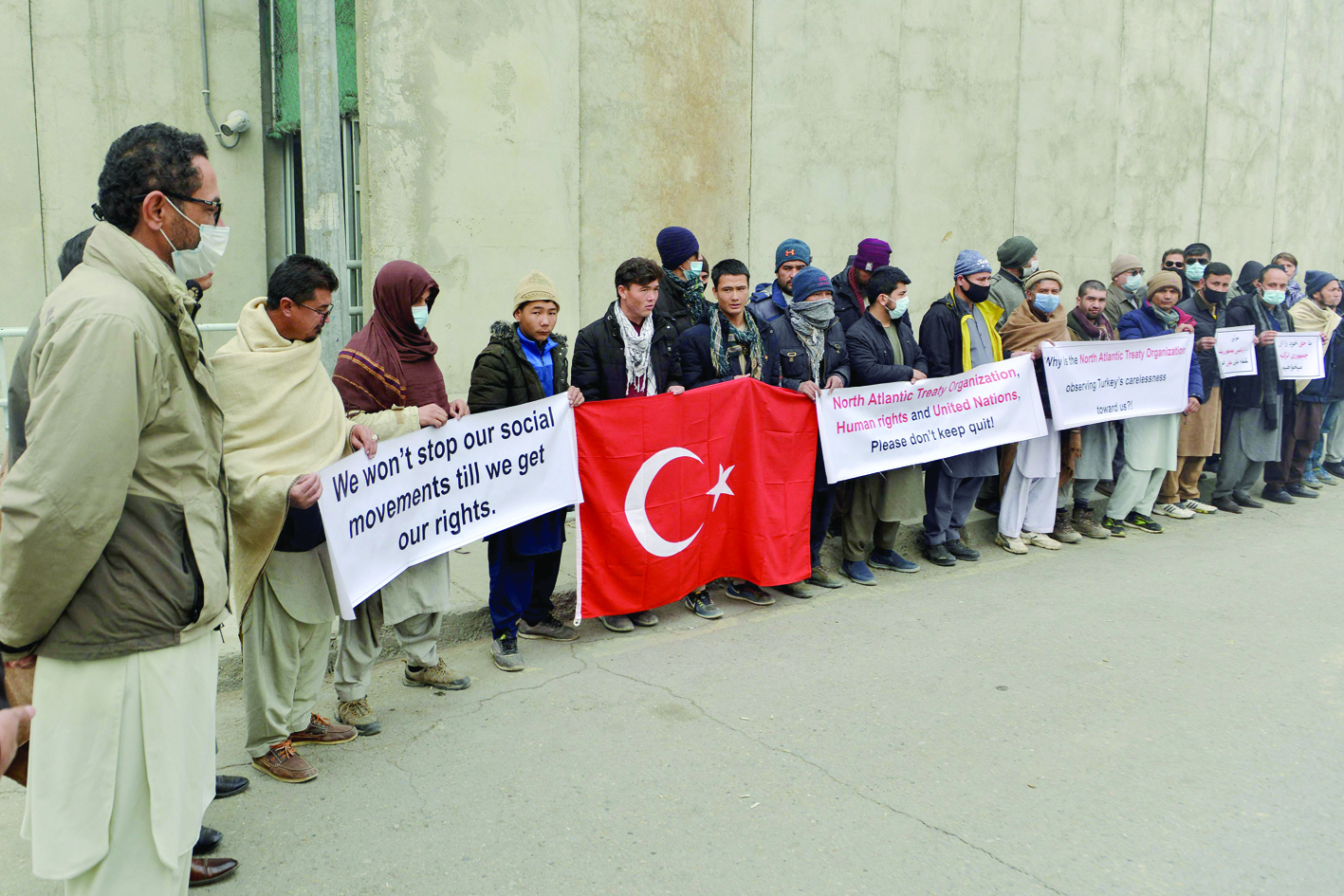 KABUL: Afghan nationals previously employed by Turkish authorities in Kabul as part of NATO’s (North Atlantic Treaty Organisation) deployment hold banners and placards during a demonstration demanding settlement of their pending wages. —AFP