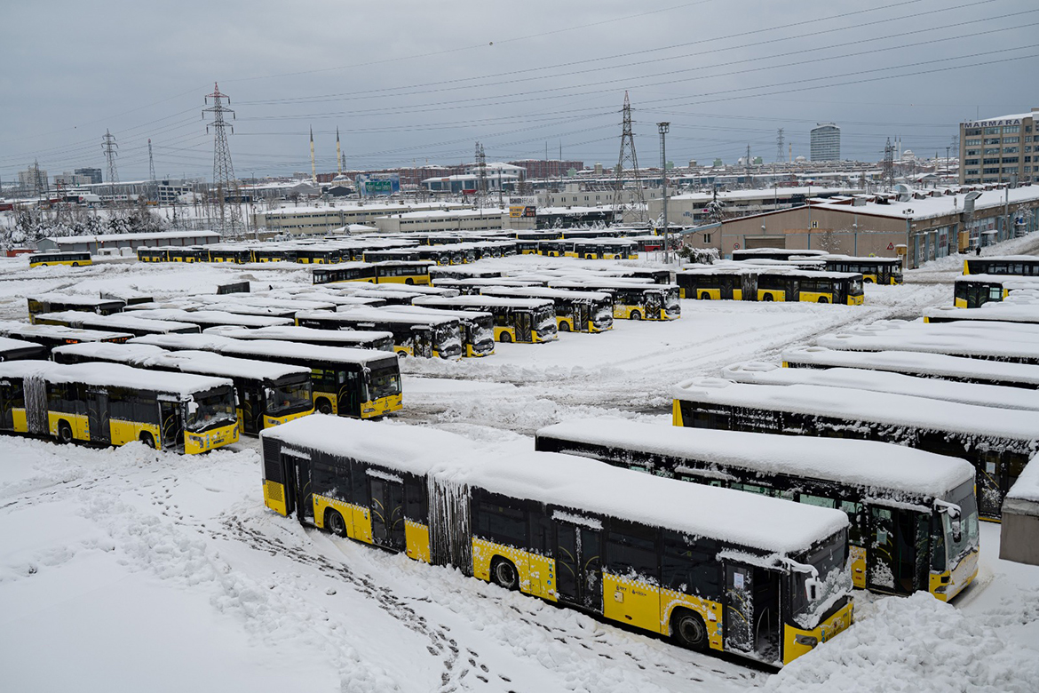 ISTANBUL: This picture taken yesterday shows buses parked at a terminal after heavy snowfall in the city's Basaksehir district. - AFP