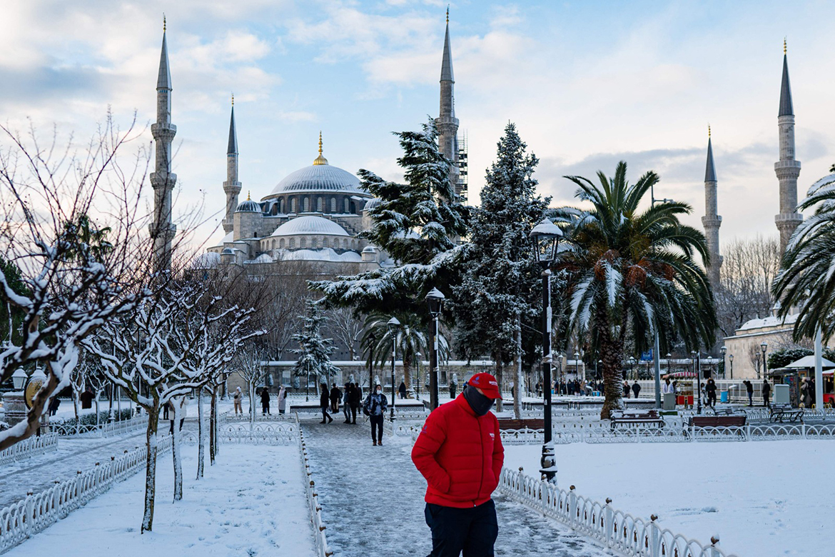 ISTANBUL: People walk in a square covered by snow in front of the Blue Mosque on Sunday.