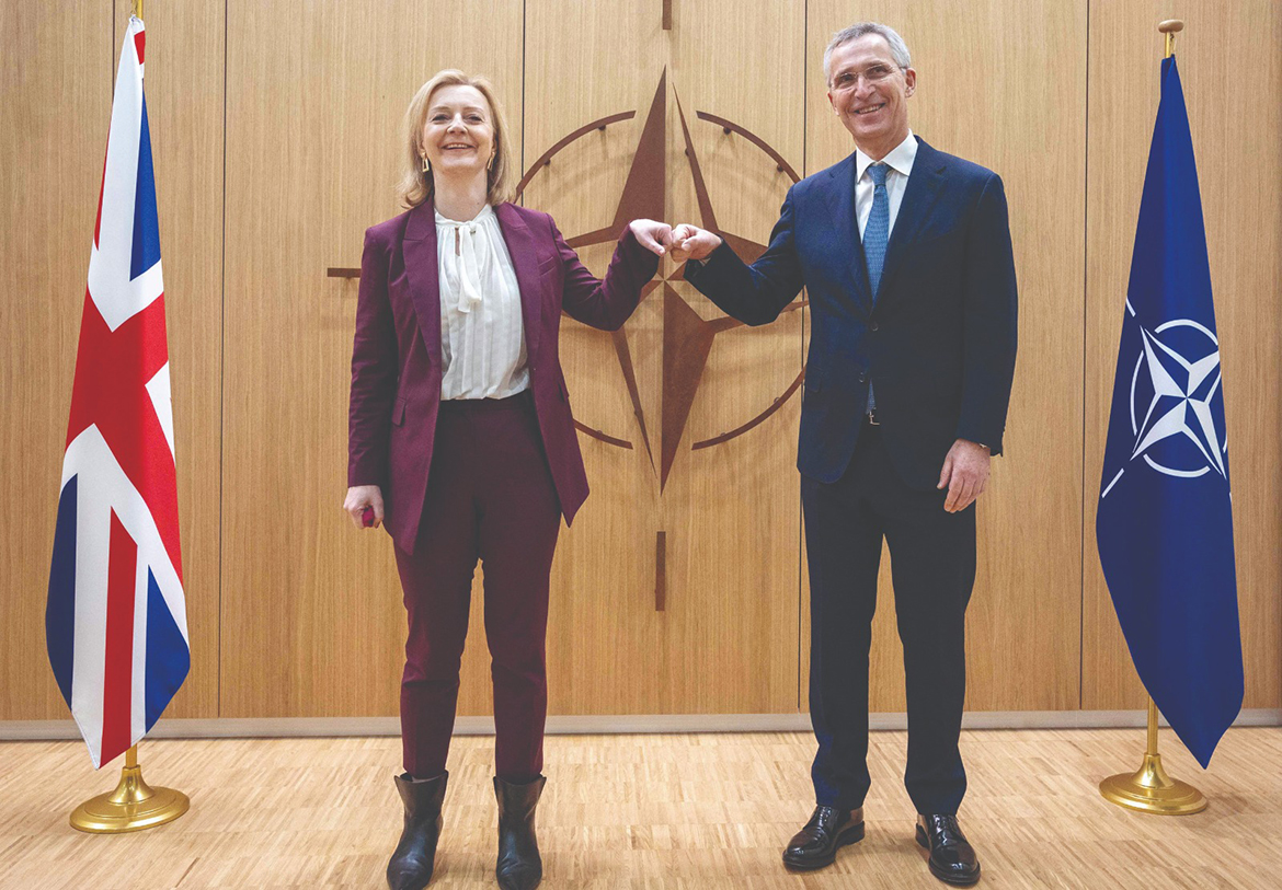 BRUSSELS: British Foreign Secretary Liz Truss (L) fists bump with NATO Secretary General Jens Stoltenberg while posing prior to a meeting at NATO headquarters in Brussels yesterday. - AFP