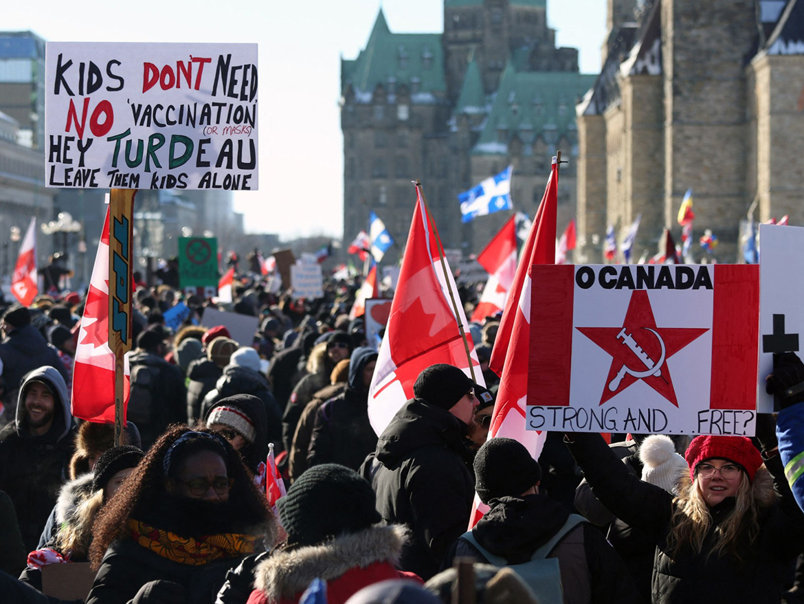 OTTAWA: Supporters of the Freedom Convoy protest COVID-19 vaccine mandates and restrictions in front of Parliament on January 29, 2022. - AFP