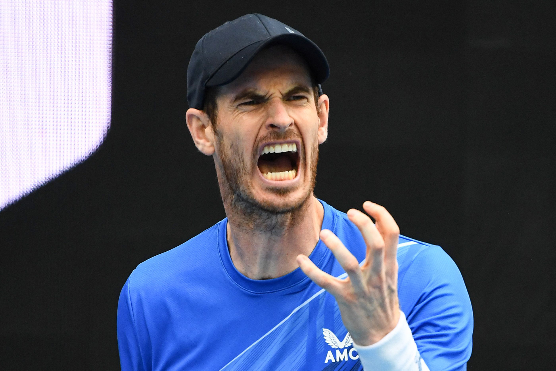 MELBOURNE: Britain’s Andy Murray reacts as he plays against Georgia’s Nikoloz Basilashvili during their men’s singles match on day two of the Australian Open tennis tournament yesterday. — AFP