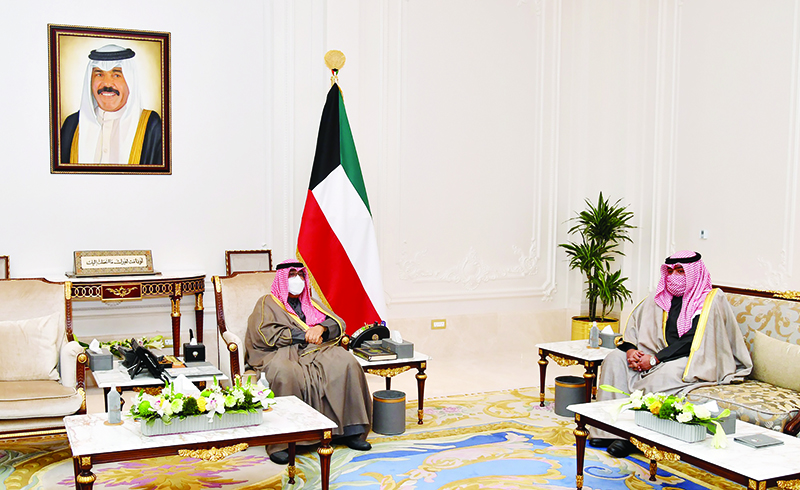 KUWAIT: His Highness the Crown Prince Sheikh Mishal Al-Ahmad Al-Jaber Al-Sabah meets former Interior Minister Sheikh Thamer Ali Sabah Al-Salem Al-Sabah. — KUNA