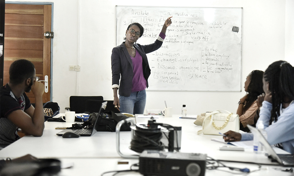 Dialika Sane (center), trainer at the Kourtrajme Dakar film school, speaks during a course with the learners on scriptwriting in Dakar. — AFP photos