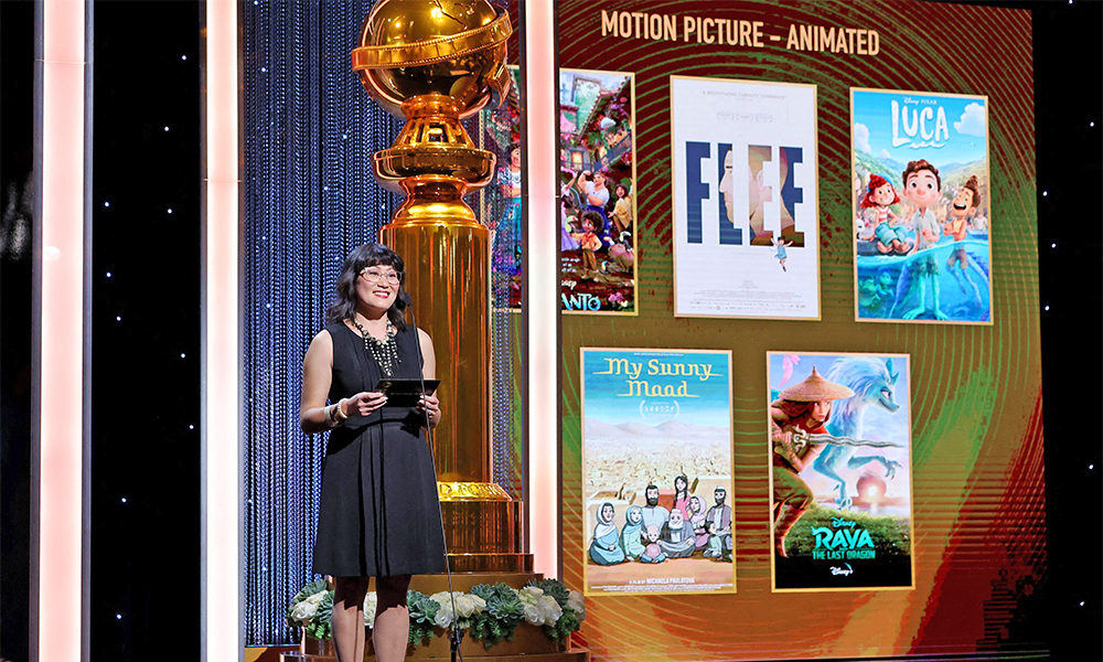 This handout image released by the Hollywood Foreign Press Association (HFPA) shows HFPA Grantee and A Place Called Home Chief Development Officer Katie Alheim presenting the Best Animated Motion Picture Award onstage during the 79th Annual Golden Globe Awards at The Beverly Hilton. — AFP photos