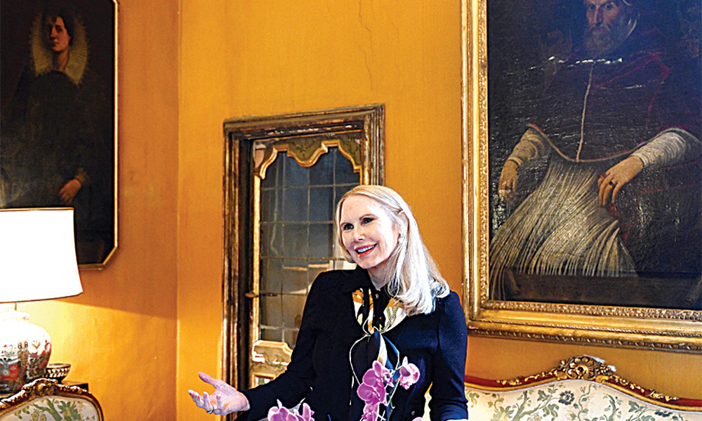 Princess Rita Boncompagni Ludovisi poses in front of a painting representing Pope Gregorio XV, at the Casino dell’Aurora inside the Villa Boncompagni Ludovisi in Rome.