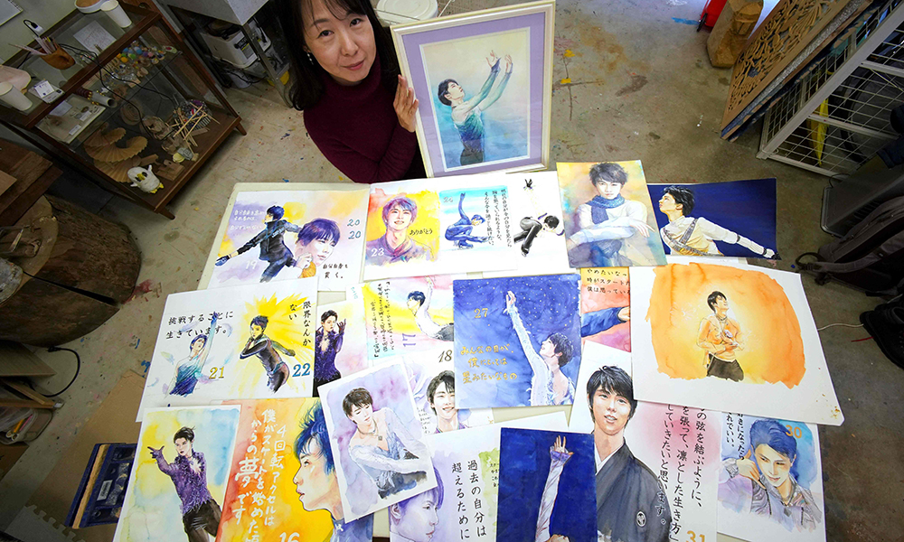 Artist Yumi Matsuo displays her paintings of Japanese figure skater Yuzuru Hanyu at her atelier in Joetsu, Niigata prefecture. n— AFP photos