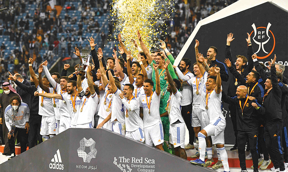 RIYADH: Real Madrid players celebrate winning the Spanish Super Cup final football match between Athletic Bilbao and Real Madrid on January 16, 2022, at the King Fahd International stadium in the Saudi capital. — AFP