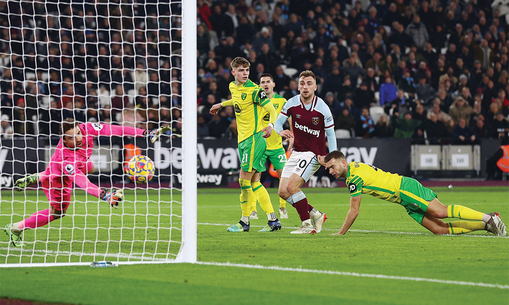 LONDON: West Ham United’s English striker Jarrod Bowen scores his team’s first goal during the English Premier League football match between West Ham and Norwich at the London Stadium, in London on Wednesday. — AFP