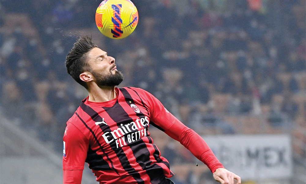 MILAN: AC Milan’s French forward Olivier Giroud goes for a header during the Italian Serie A football match between AC Milan and Juventus on January 23, 2022. — AFP