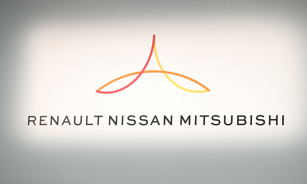YOKOHAMA, Japan: File photo taken on March 12, 2019 shows a logo showing Renault, Nissan and Mitsubishi ahead of a press conference at the Nissan headquarters in Yokohama, Kanagawa prefecture. The Nissan auto alliance said yesterday it will invest 23 billion euros ($25.7 billion USD) into electric vehicles. - AFP