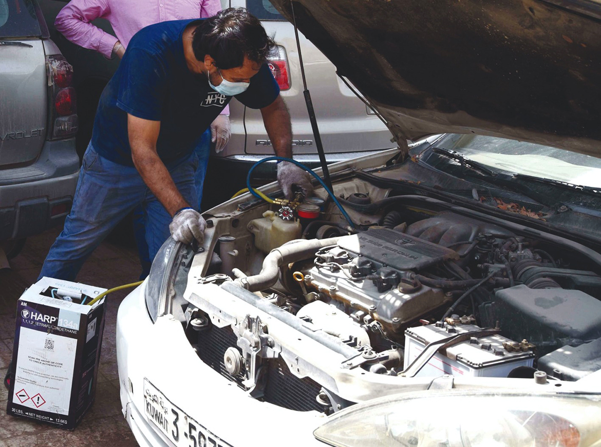 KUWAIT: A mechanic inspects a car. - Photo by Yasser Al-Zayyat