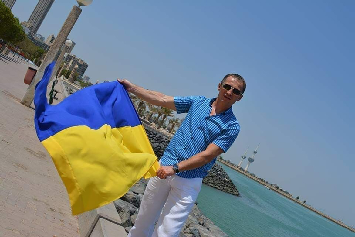 KUWAIT: Dmitro Malets displays the Ukrainian national flag.