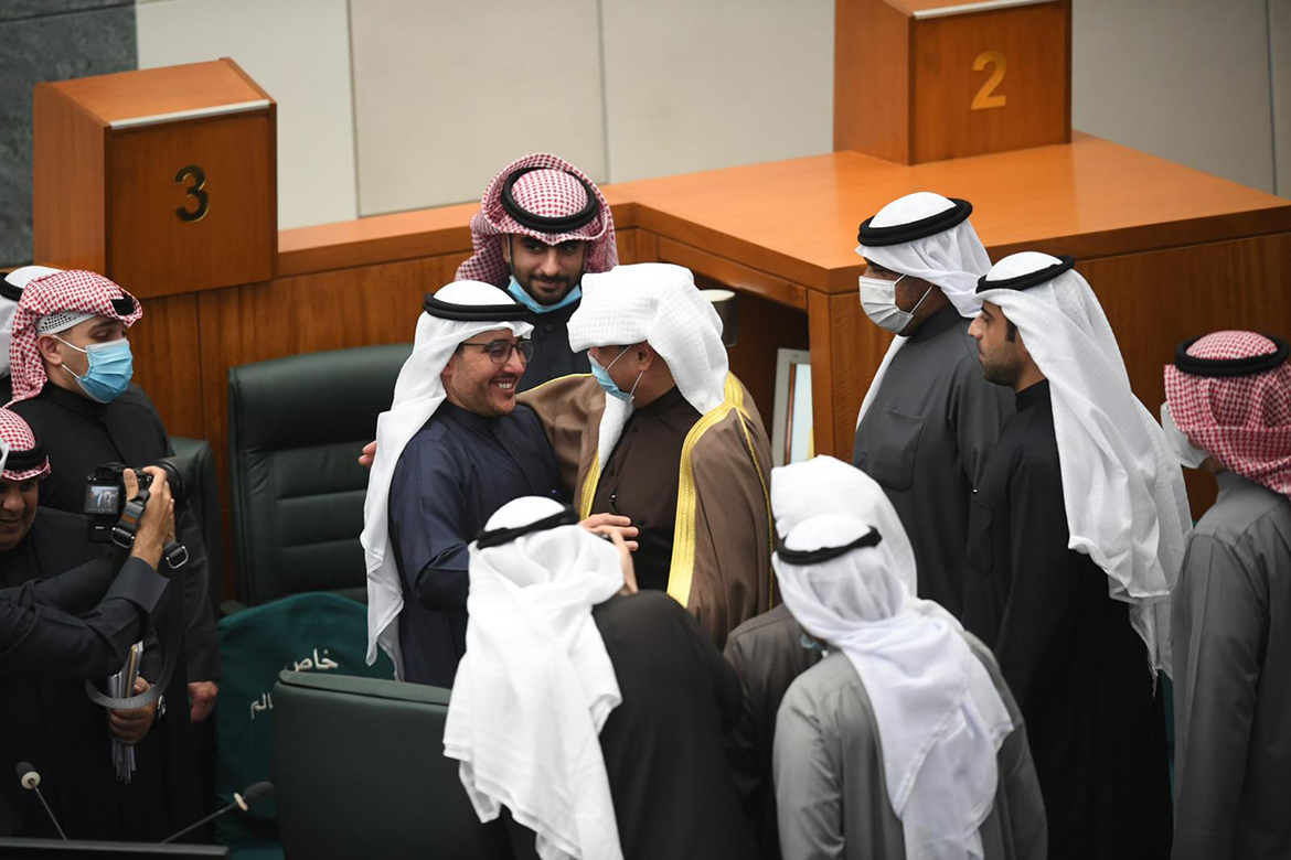 KUWAIT: Foreign Minister Sheikh Ahmad Nasser Al-Sabah is surrounded by fellow ministers during a National Assembly session yesterday. – Photo by Yasser Al-Zayyat