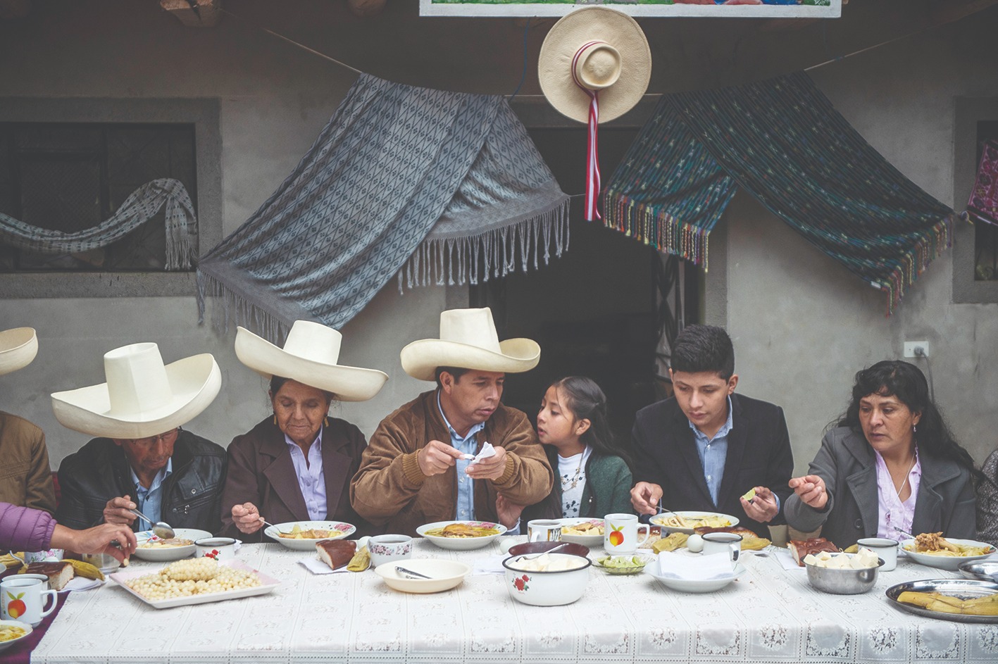 LIMA: In this file photo taken on June 06, 2021 Peruvian left-wing presidential candidate for Peru Libre party, Pedro Castillo (center) accompanied with his family, participates on a breakfast open to the press during the election day at his house in Chugur, Cajamarca region, north east of Peru. - AFP
