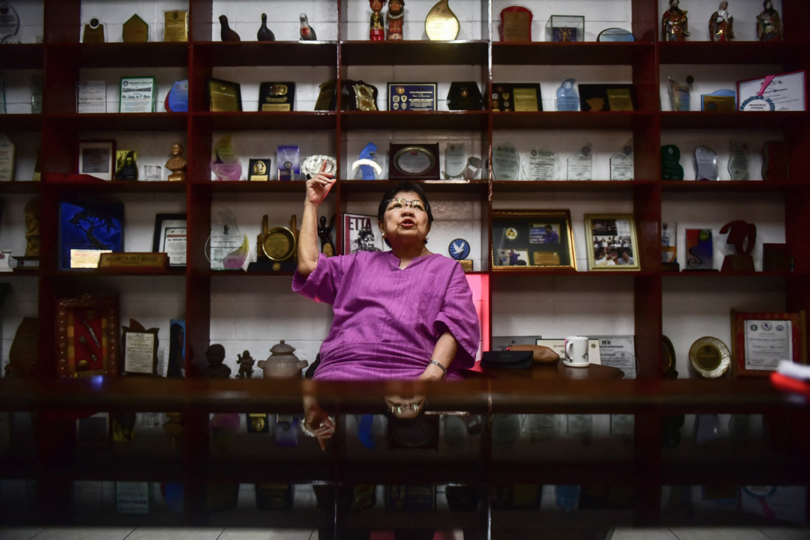 MANILA, Philippines: This photo taken on February 9, 2022 shows Loretta Ann P. Rosales, a victim of the country's martial law in the 1970s, gesturing during an interview with AFP at her residence in Quezon City, suburban Manila. - AFP