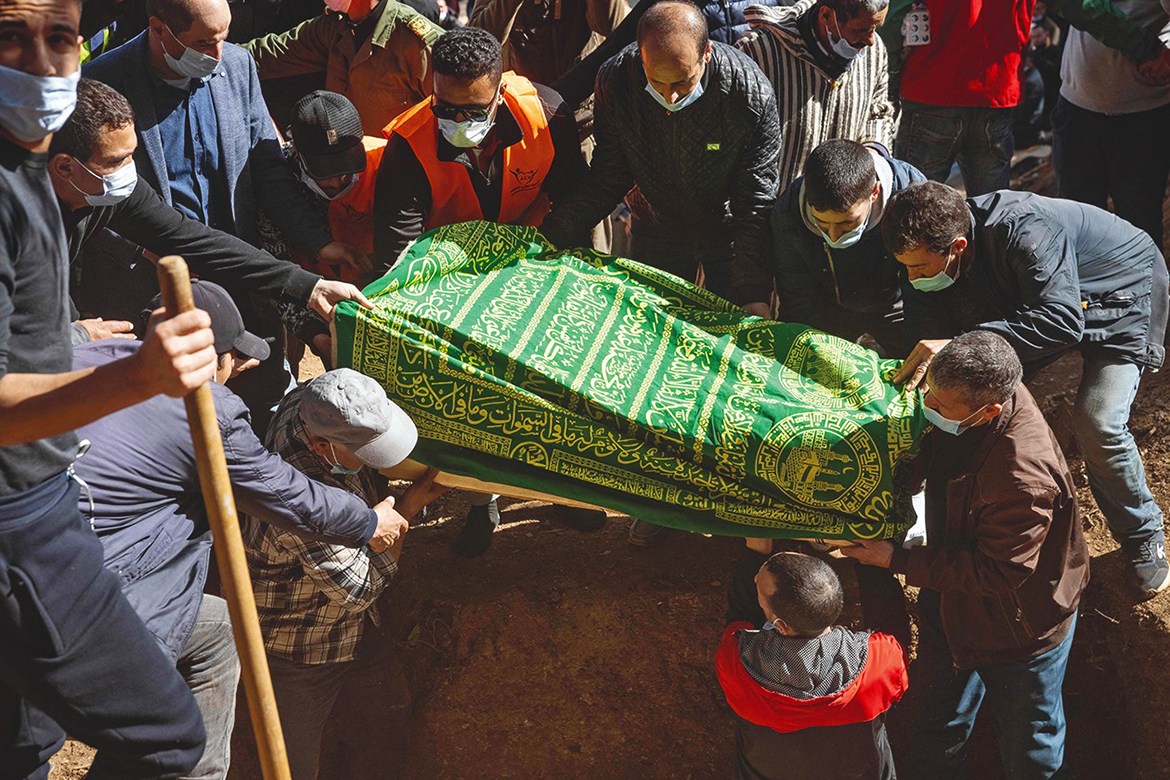 BAB BERRED, Morocco: Moroccans bury five-year-old Rayan Oram in the village of Ighrane in Morocco's rural northern province of Chefchaouen yesterday. – AFP
