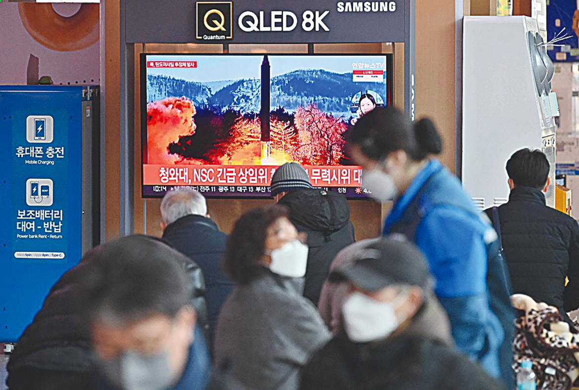 SEOUL: People watch a television screen showing a news broadcast with file footage of a North Korean missile test, at a railway station in Seoul yesterday. - AFP