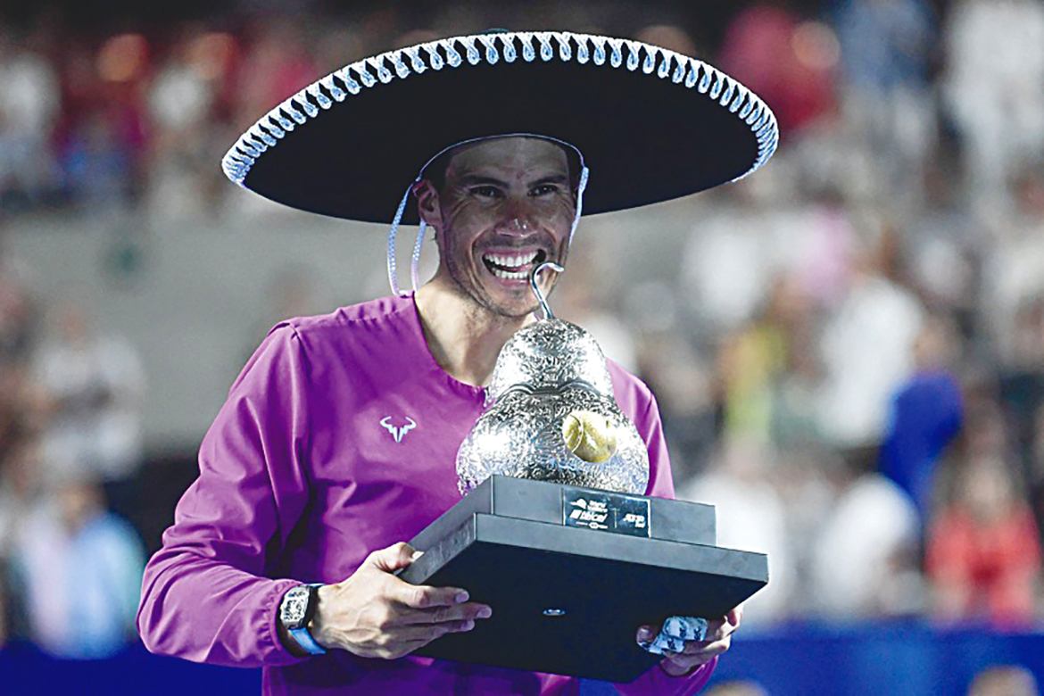 ACAPULCO: Spain's Rafael Nadal wears a traditional Mexican mariachi hat while holding the winning trophy after defeating Britain's Cameron Norrie in the Mexico ATP Open men's single final on Saturday. - AFP