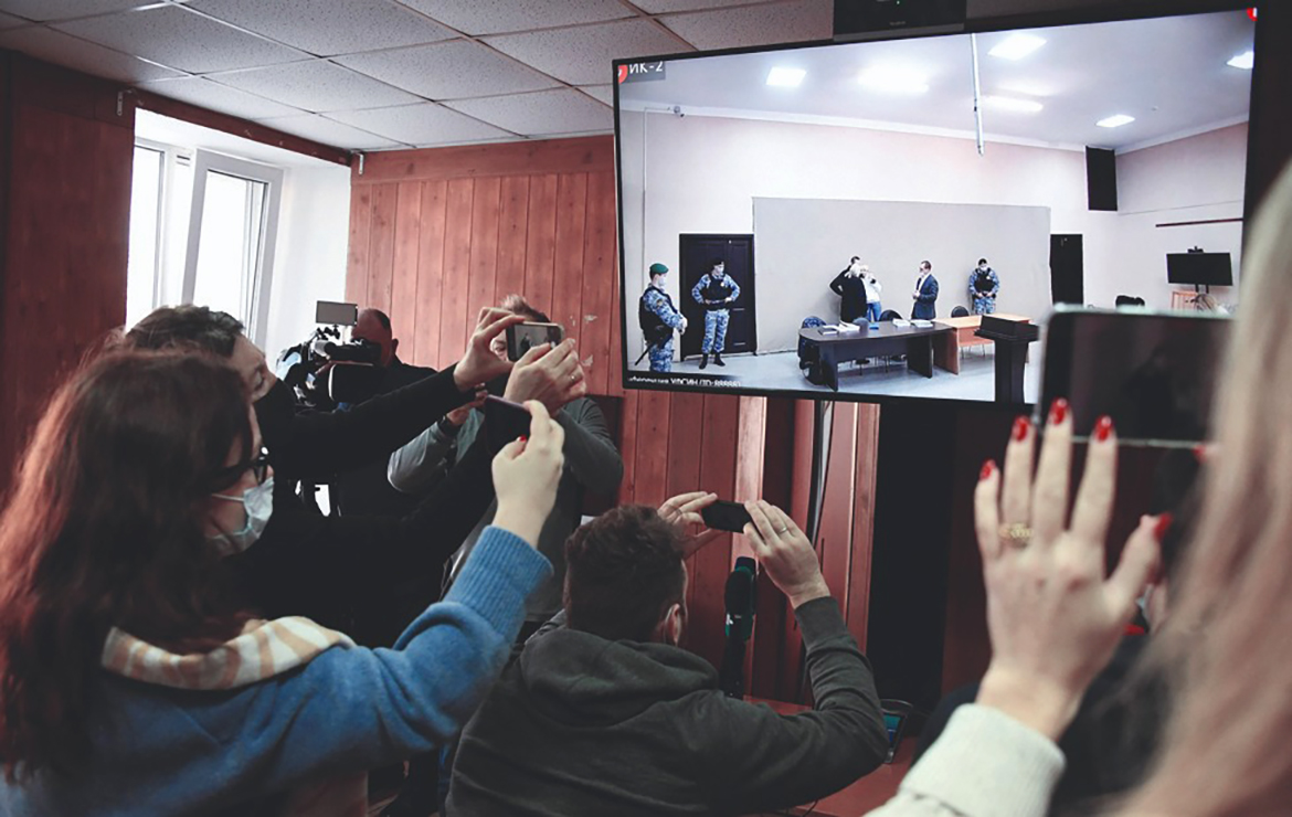 POKROV, Vladimir Oblast: Journalists watch live broadcast of the court hearing from the press room of the penal colony N2, on the first day of the new trial of Kremlin critic Alexei Navalny, in the town of Pokrov yesterday. - AFP