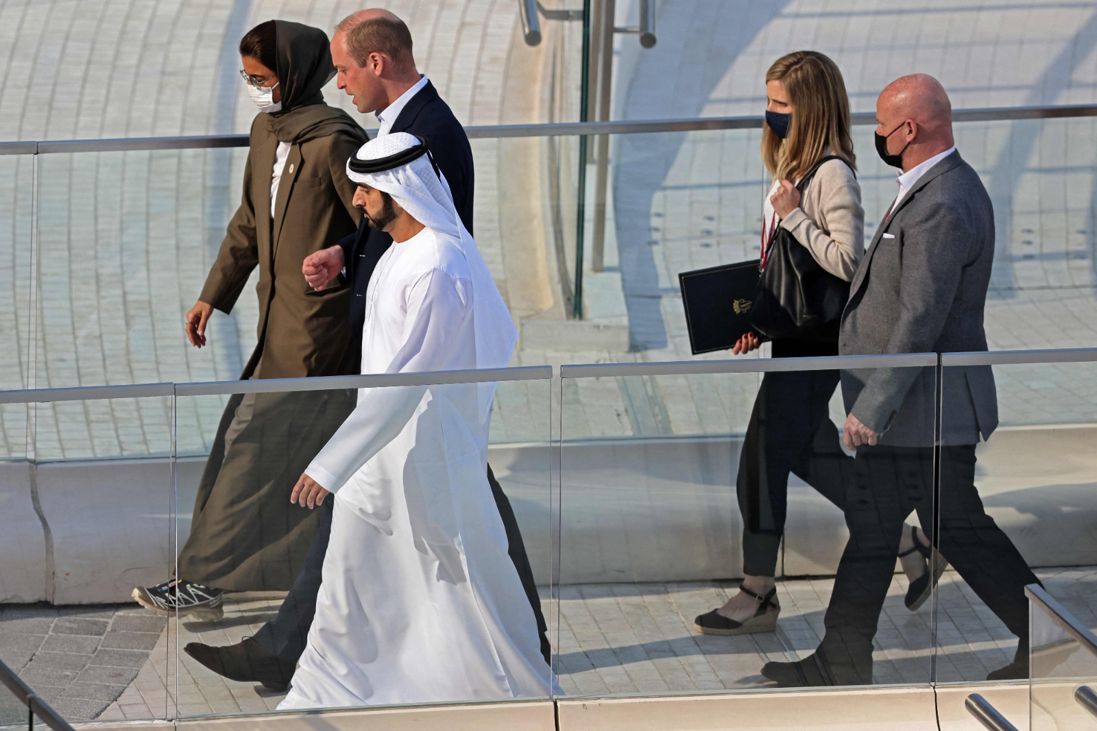 Crown Prince of Dubai Sheikh Hamdan bin Mohammed (R) welcomes Britain's Prince William, Duke of Cambridge during a visit to the Emirati pavilion at Expo 2020, in the Gulf emirate of Dubai, on February 10, 2022. – AFP
