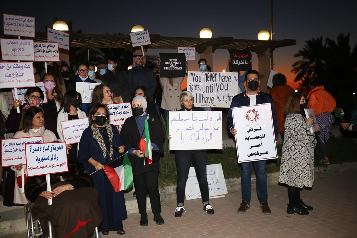 KUWAIT: Activists rally in support of women’s rights outside the National Assembly yesterday. – Photo by Yasser Al-Zayyat