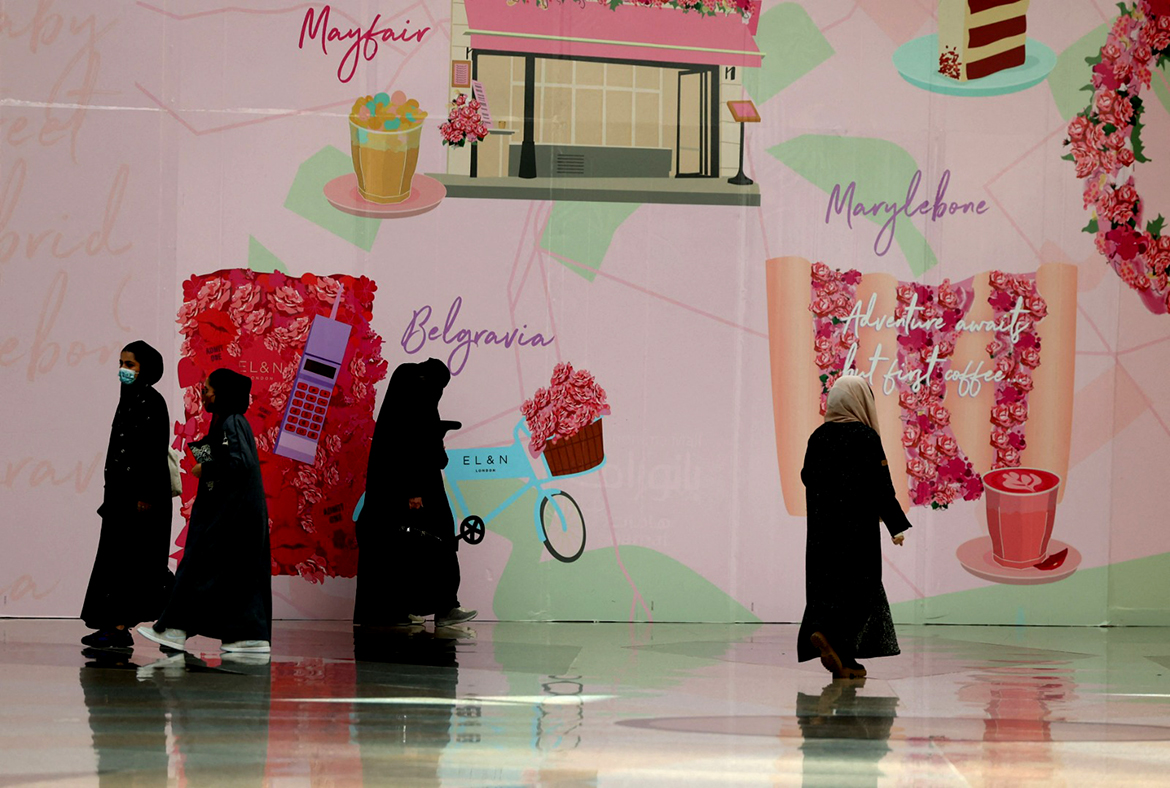 RIYADH: Women walk past shop advertisements ahead of Valentine's Day in Panorama mall on Feb 9, 2022. - AFP