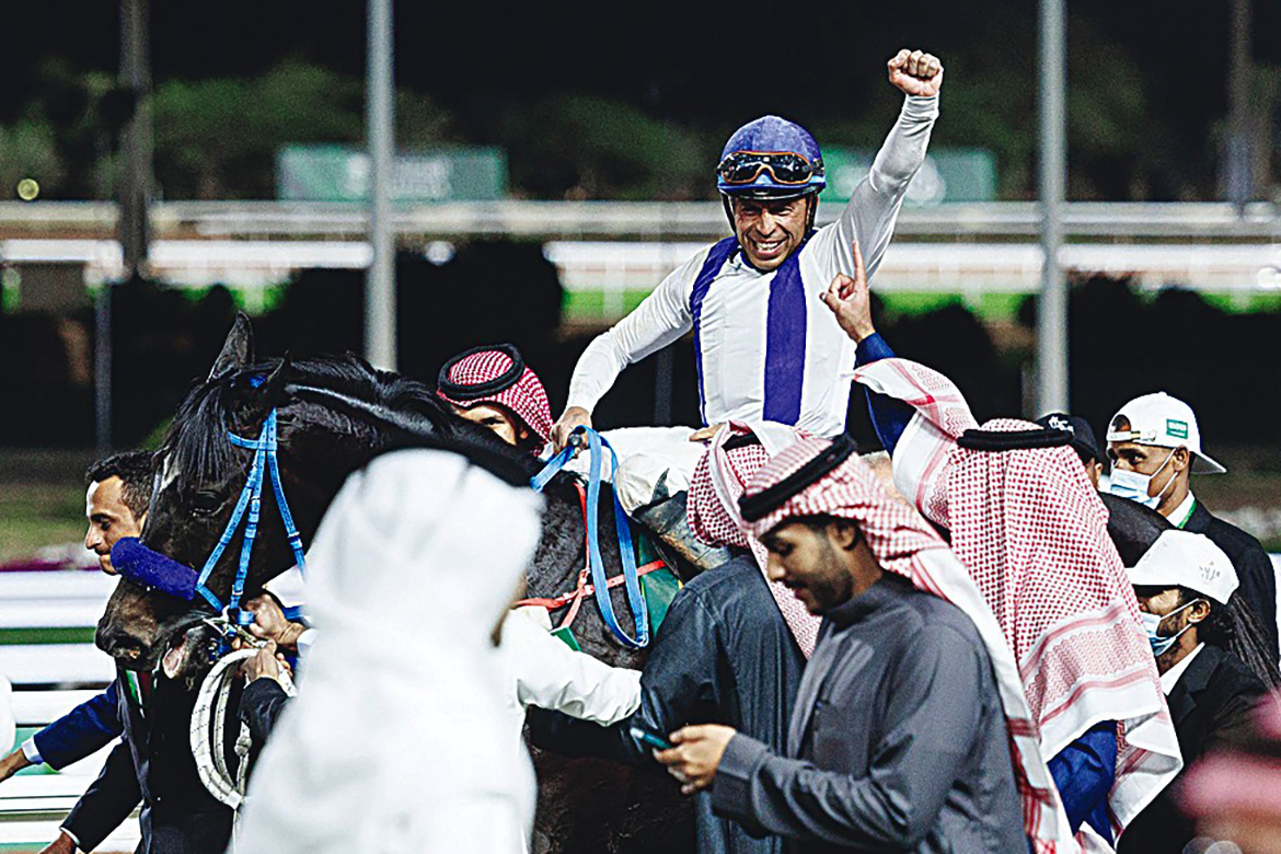 RIYADH: Jockey Wigberto Ramos with Emblem Road celebrates after he won the 1800m race of the Saudi Cup on Saturday. - AFP