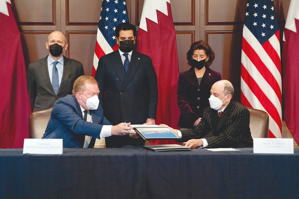 WASHINGTON: Stan Deal, President and CEO of Boeing Commercial Airplanes (left), and Akbar Al-Baker, Group Chief Executive Officer of Qatar Airways, participate in a signing ceremony in the Eisenhower Executive Office building in Washington, DC, on Monday.-AFP