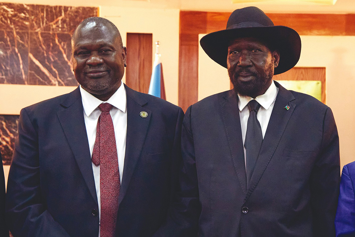 JUBA: File photo shows South Sudanese President Salva Kiir (R) stands with First Vice President Riek Machar as they attend a swearing-in ceremony at the State House in Juba, South Sudan. Tuesday will mark two years since President Salva Kiir and his deputy Riek Machar formed a unity government. - AFP