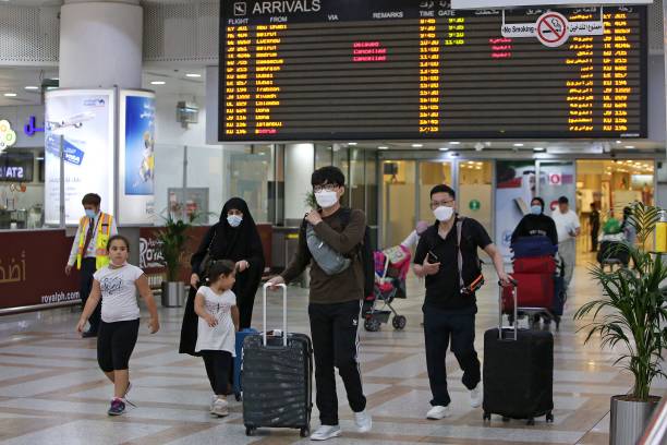 Expats, who are fully vaccinated against COVID-19,  arrive at Kuwait international airport in Kuwait City on August 1, 2021. (Photo by YASSER AL-ZAYYAT / AFP) (Photo by YASSER AL-ZAYYAT/AFP via Getty Images)