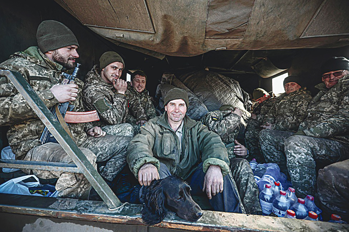 UKRAINE: Ukraine's Military Forces servicemen sit in the back of military truck in the Donetsk region town of Avdiivka, on the eastern Ukraine front-line with Russia-backed separatists.-AFP