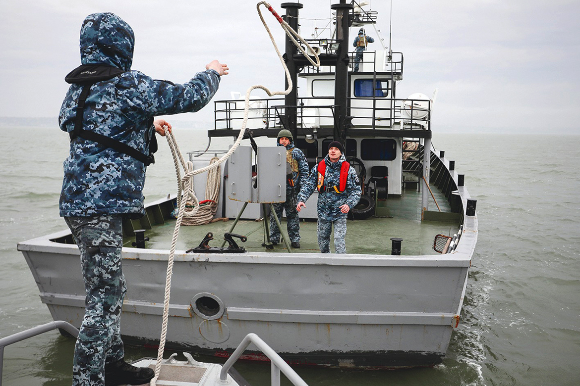MARIUPOL, Ukraine: A patrol boat casts off the border base in Ukraine's Black Sea port of Mariupol on Friday. Russia has sent six additional warships into the region for a week of naval drills involving dozens of big navy ships starting this weekend. - AFP