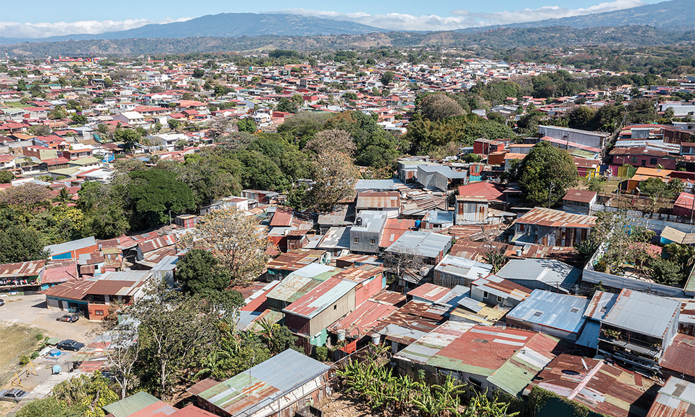 ALAJUELA, Costa Rica: Aerial view of El Erizo (left) low-income neighborhood and the modern neighborhood of Ciruelas, in the province of Alajuela, Costa Rica. —AFP