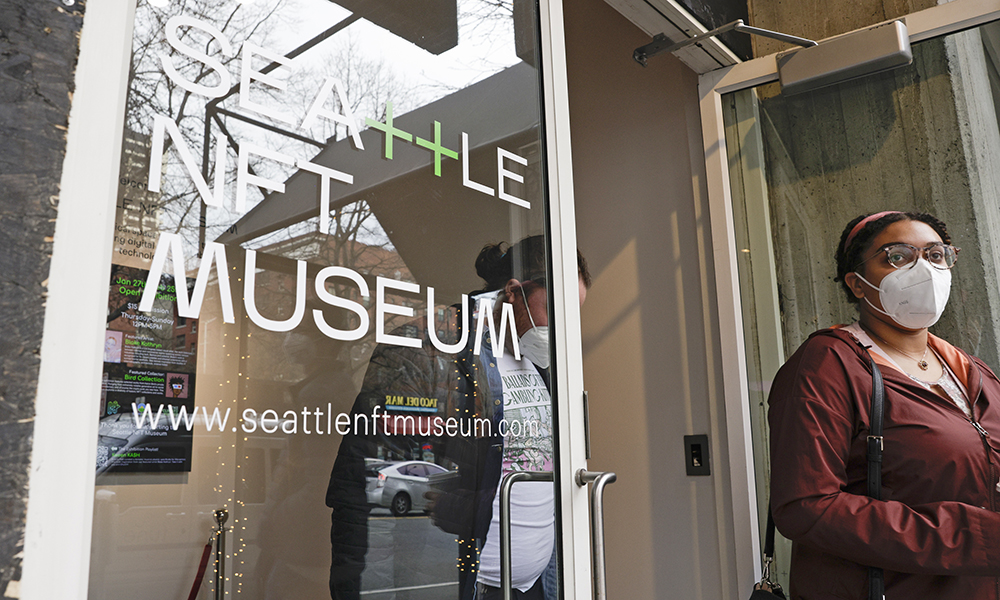 Visitors exit the Seattle NFT Museum during its opening weekend in Seattle, Washington. Using the blockchain technology behind cryptocurrencies, Non-fungible tokens (NFTs) transform anything from illustrations to memes into virtual collectors’ items that cannot be duplicated. — AFP photos