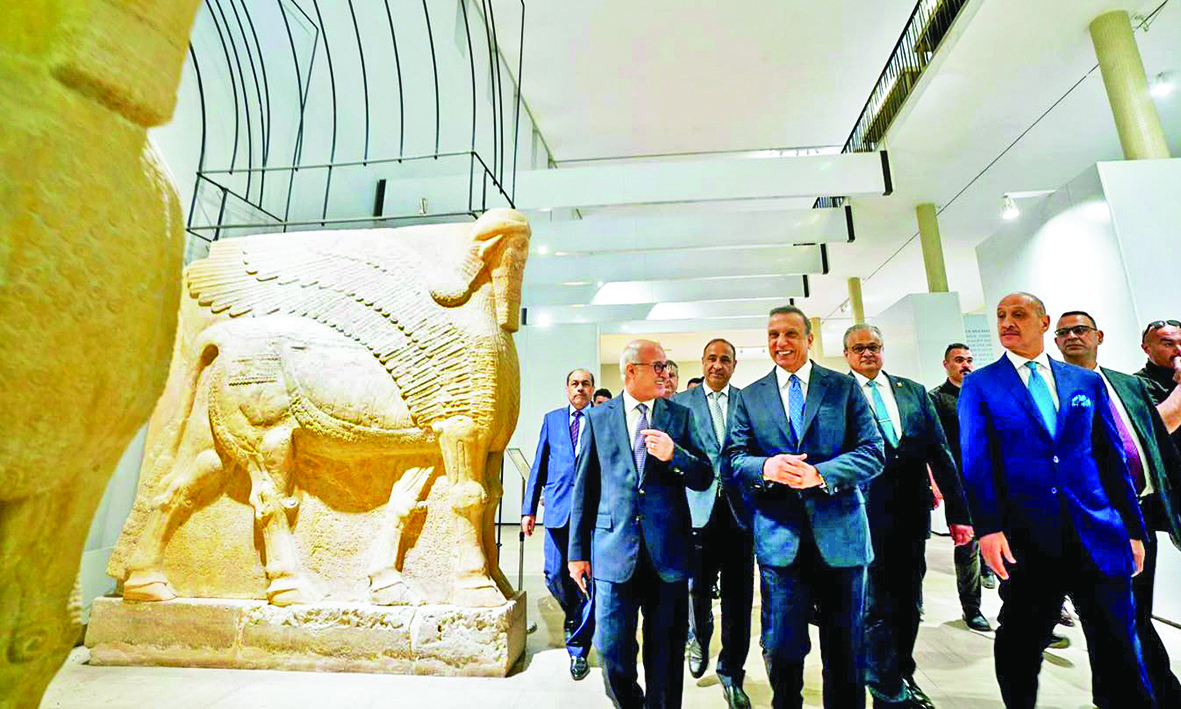 A handout picture released by the Iraqi Prime Minister’s Media Office shows Premier Mustafa Al-Kadhemi (center) inaugurating the renovated National Museum as it reopens following a 3-year closure.—AFP n