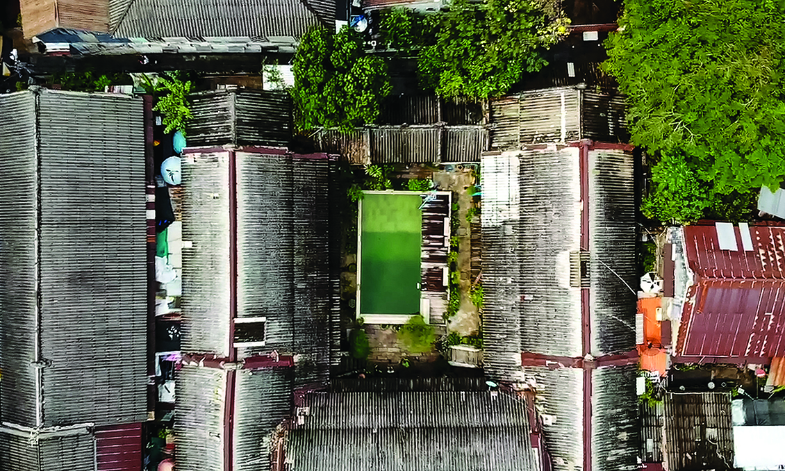 This aerial screenshot from an AFPTV video shows a swimming pool in the courtyard of the So Heng Tai mansion in the Talad Noi neighbourhood of Bangkok.—AFP photosn