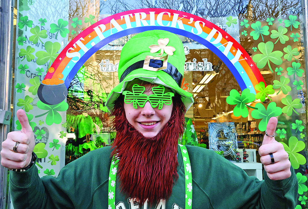 A French tourist poses for a photograph ahead of the annual St Patrick's Day parade in Dublin.—AFP n