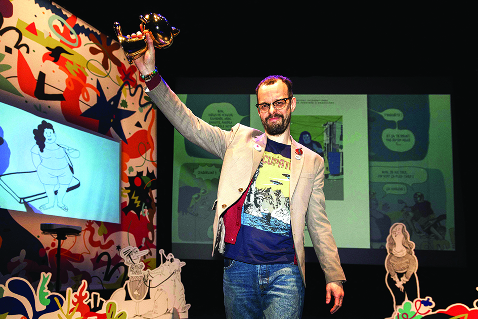 Brazilian comic book author Marcello Quintanilha receives the Fauve d’or - Prix du meilleur album with « Ecoute jolie Marcia » during the 49th Angouleme International Comics Festival (Festival International de la Bande Dessinee) in Angouleme, western France.—AFPn