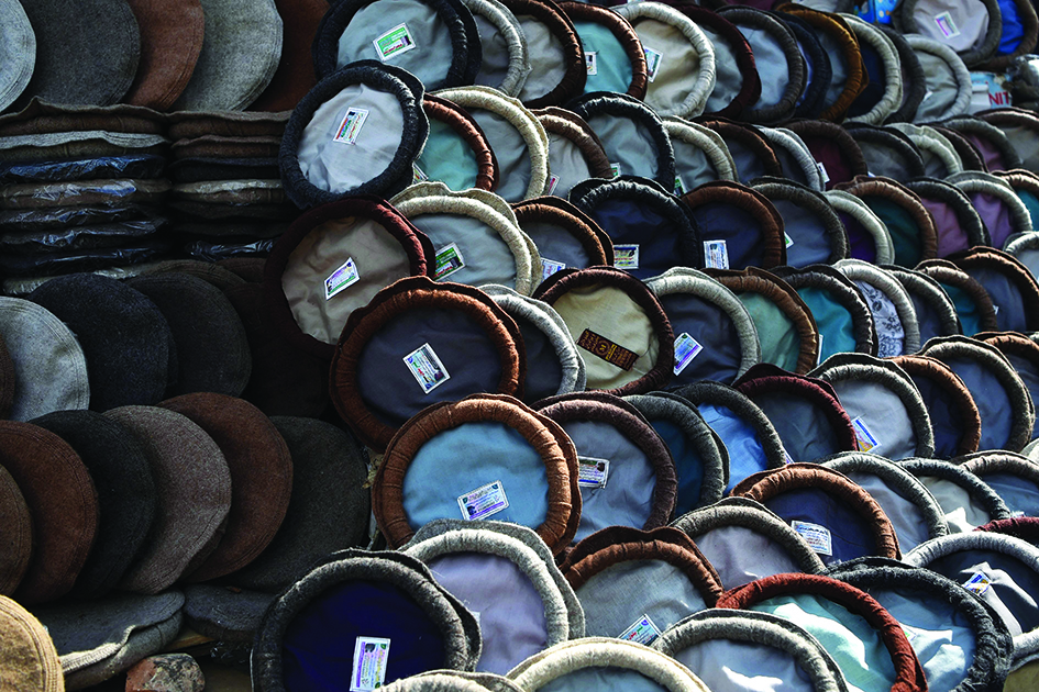 Pakol hats are on display for sale at a stall in a market near the Pul-e Khishti Mosque in Kabul. <br>