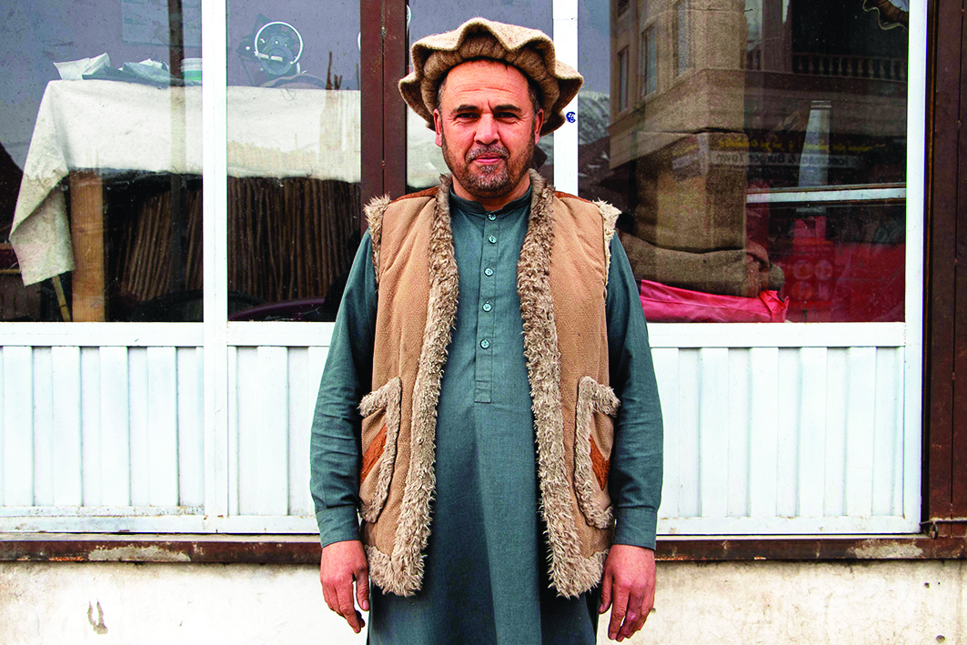 An Afghan man wearing a pakol hat poses for a photograph in Fayzabad, Badakhshan province.<br>