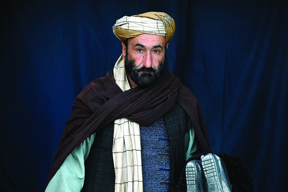 An Afghan man wearing a turban arrives at a mosque in Herat.<br>