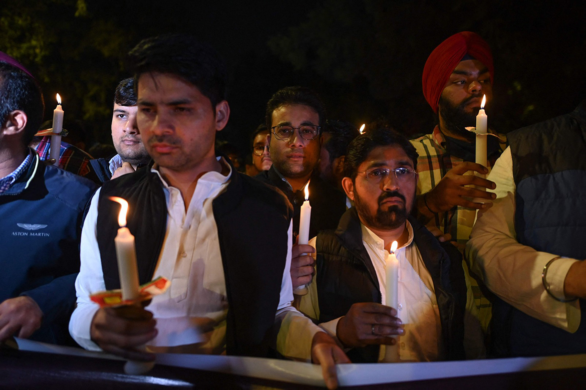 NEW DELHI: Activists of the Indian Youth Congress take part in a candle lighting for the Indian student who was killed in shelling in Ukraine, in New Delhi on March 1, 2022. - AFP