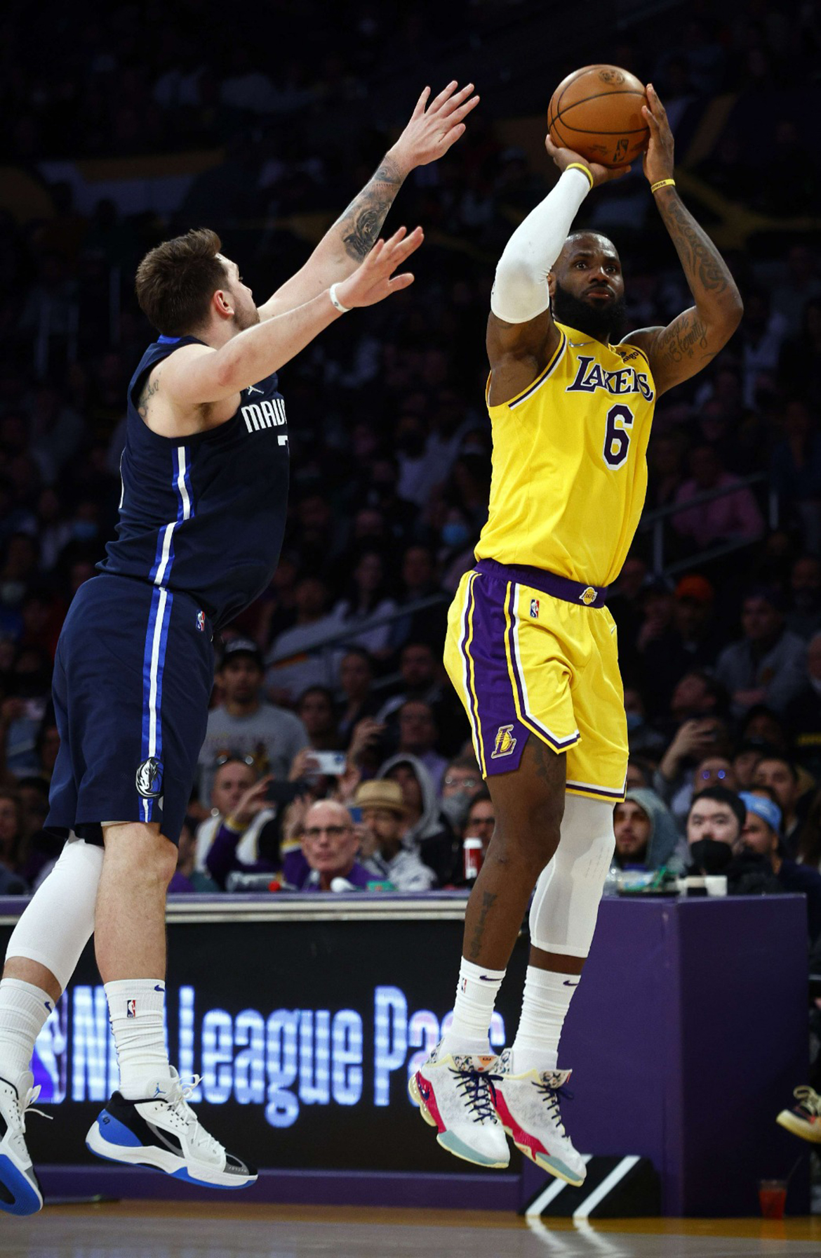 LOS ANGELES: LeBron James #6 of the Los Angeles Lakers takes a shot against Luka Doncic #77 of the Dallas Mavericks in the fourth quarter at Crypto.com Arena on March 01, 2022.- AFP