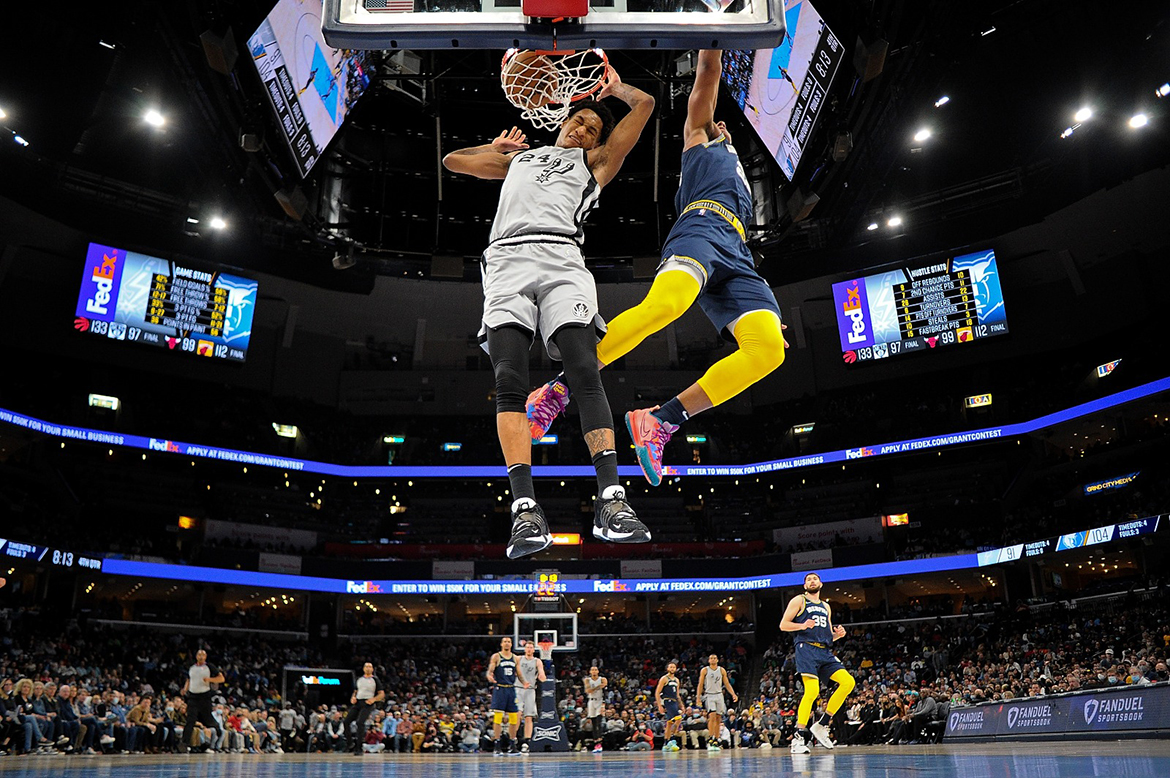 MEMPHIS: Devin Vassell #24 of the San Antonio Spurs dunks against Desmond Bane #22 of the Memphis Grizzlies during the second half at FedExForum in Memphis, Tennessee. - AFP