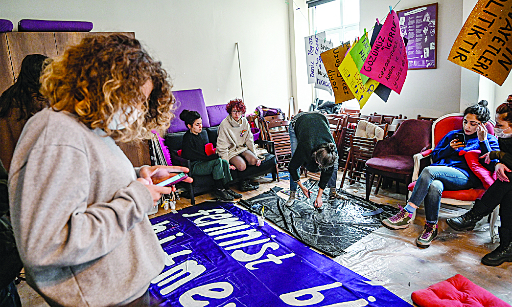 Istanbul, Turkey: Activists paint banners and placards as they prepare for a feminist march to mark International Women's Day in Beyoglu district in Istanbul. - AFPnn