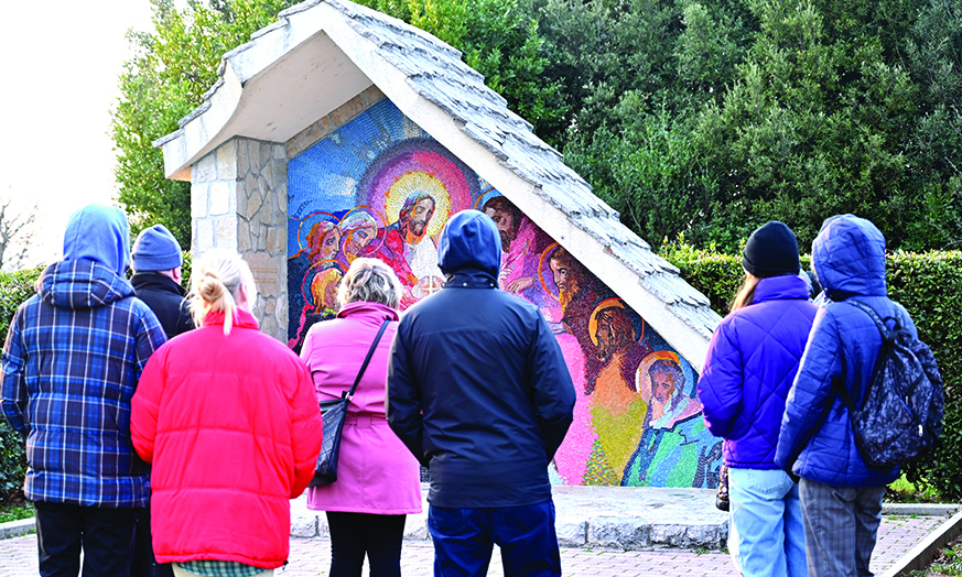 MEDJUGORJE: Pilgrims stand near St. Jacob church, in Southern-Bosnian town of Medjugorje. Although never recognized by Rome, after alleged St. Marry apparition in the hills close to the town, 41 years ago, Medjugorje became one of worlds popular Marian pilgrimages. – AFPnn