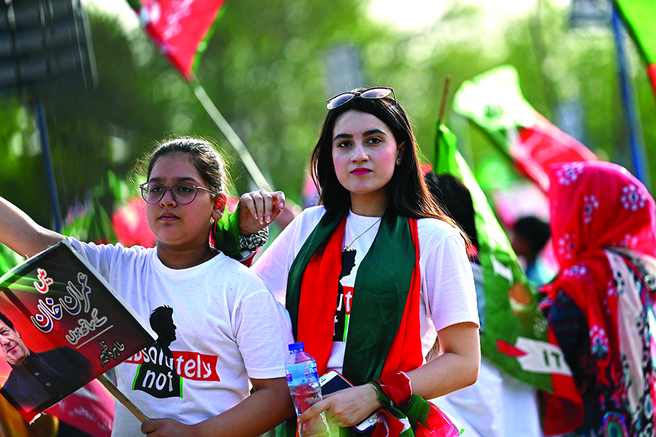 ISLAMABAD: Supporters of ruling Pakistan Tehreek-e-Insaf (PTI) party attend a rally being addressed by Pakistan's Prime Minister Imran Khan, in Islamabad on March 27, 2022.—AFPnn