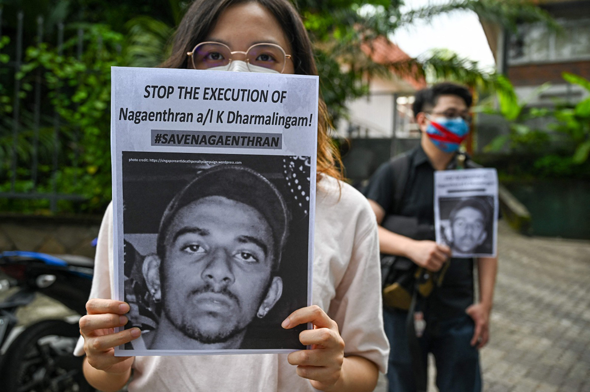 KUALA LUMPUR: Activists hold placards before submitting a memorandum to parliament in protest of the impending execution of Nagaenthran K Dharmalingam, sentenced to death for trafficking heroin into Singapore.- AFP