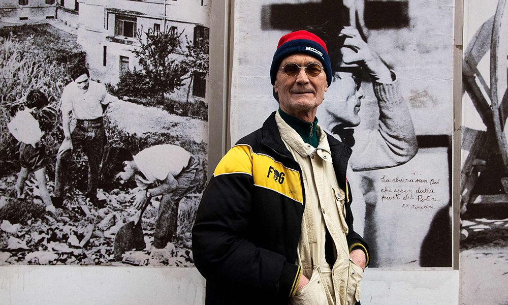 Silvio Parrello, dubbed ‘Er Pecetto’, poses past Pasolini’s pictures on the wall of his artist’s workshop in Monteverde district in Rome.— AFP